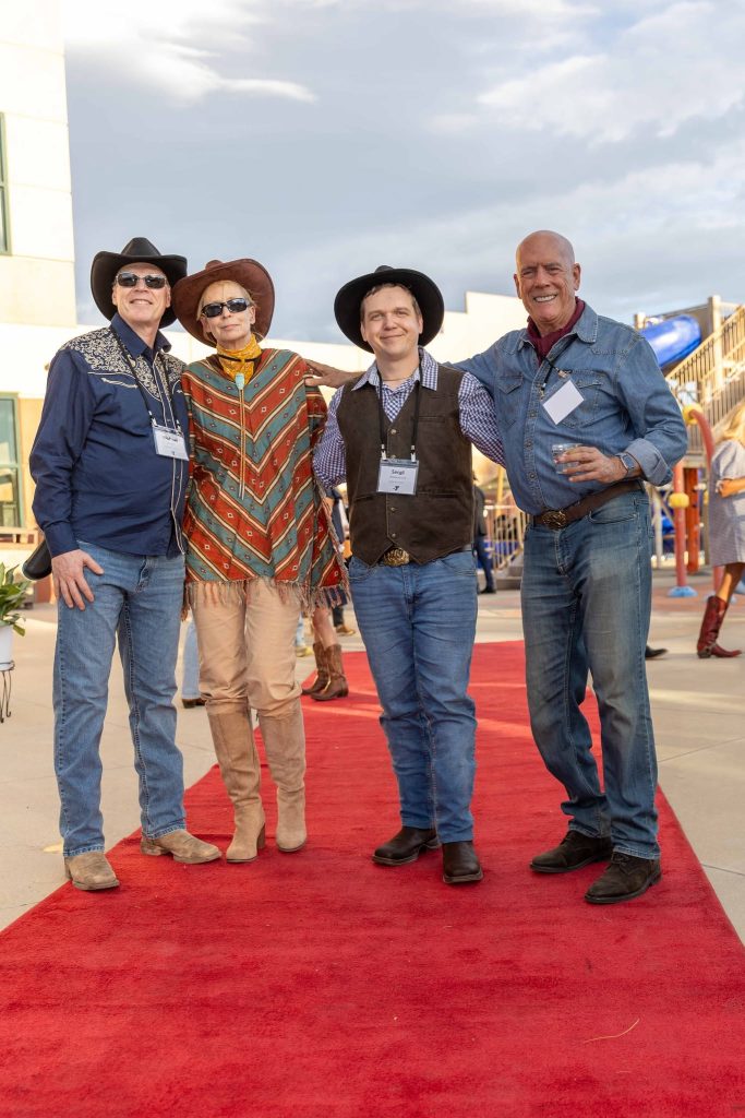 Michael and Cassidy Brady with Sergii and Doug Gardner of Boulder–Vinnytsia Sister City at YMCA of Northern Colorado Y Splash.